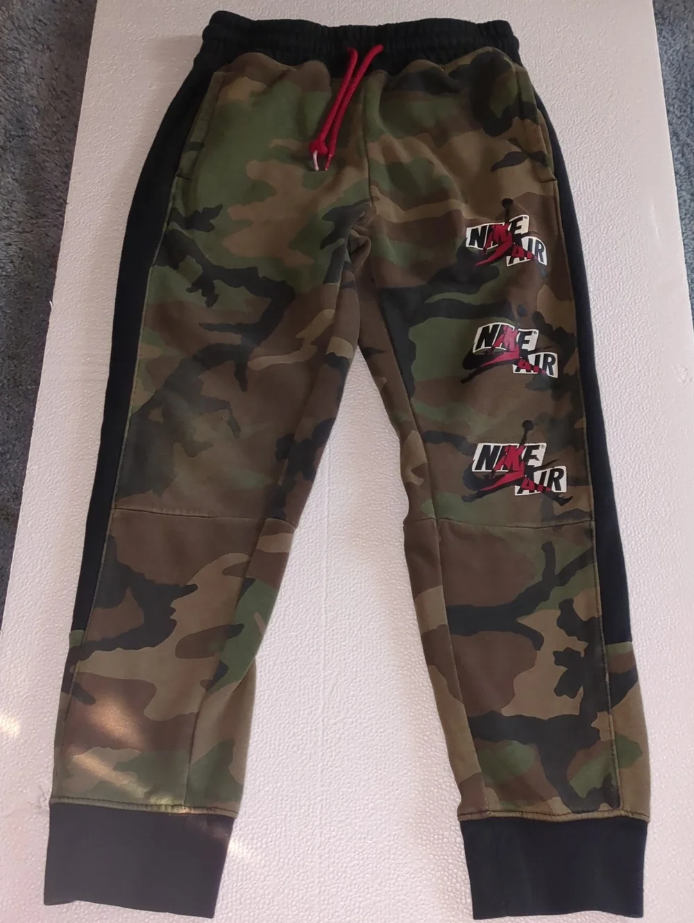Nike Kids Camo Joggers with Black Panels and Red Drawstring Small 8-10 Yrs